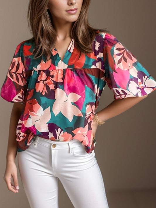 Blusa estampada con mangas abullonadas y muescas