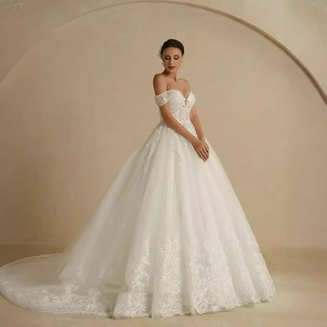 Vestido de novia principal con hombros descubiertos, elegante estilo de corte, hilo de puerta ligera francesa de lujo de alta calidad