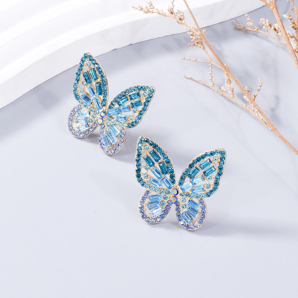 Pendientes de mariposa con diamantes de imitación con incrustaciones de aleación