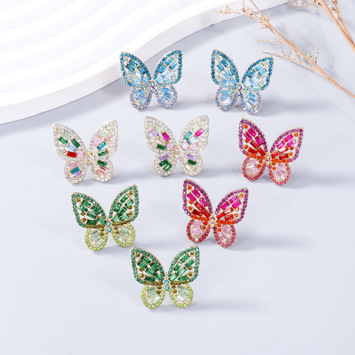 Pendientes de mariposa con diamantes de imitación con incrustaciones de aleación