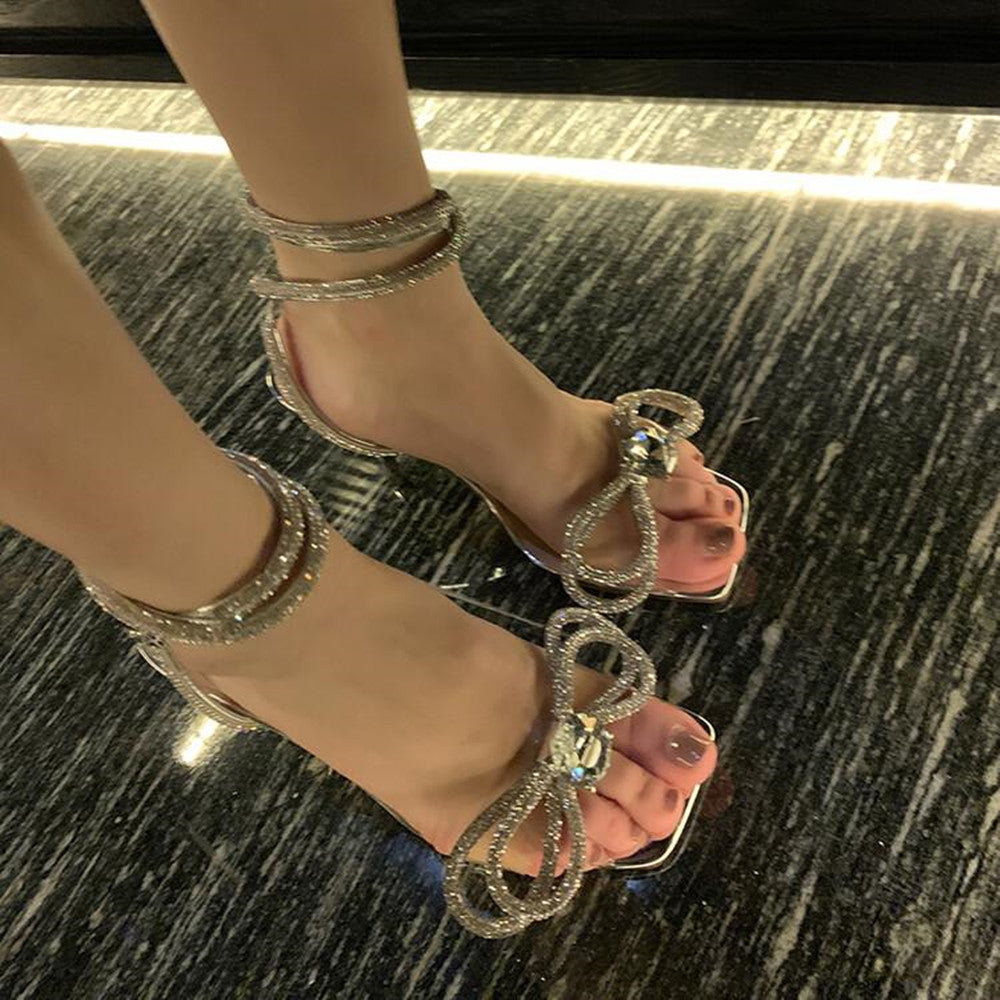 Zapatos transparentes con lazo de diamantes de imitación y tacón de aguja con correa en el tobillo